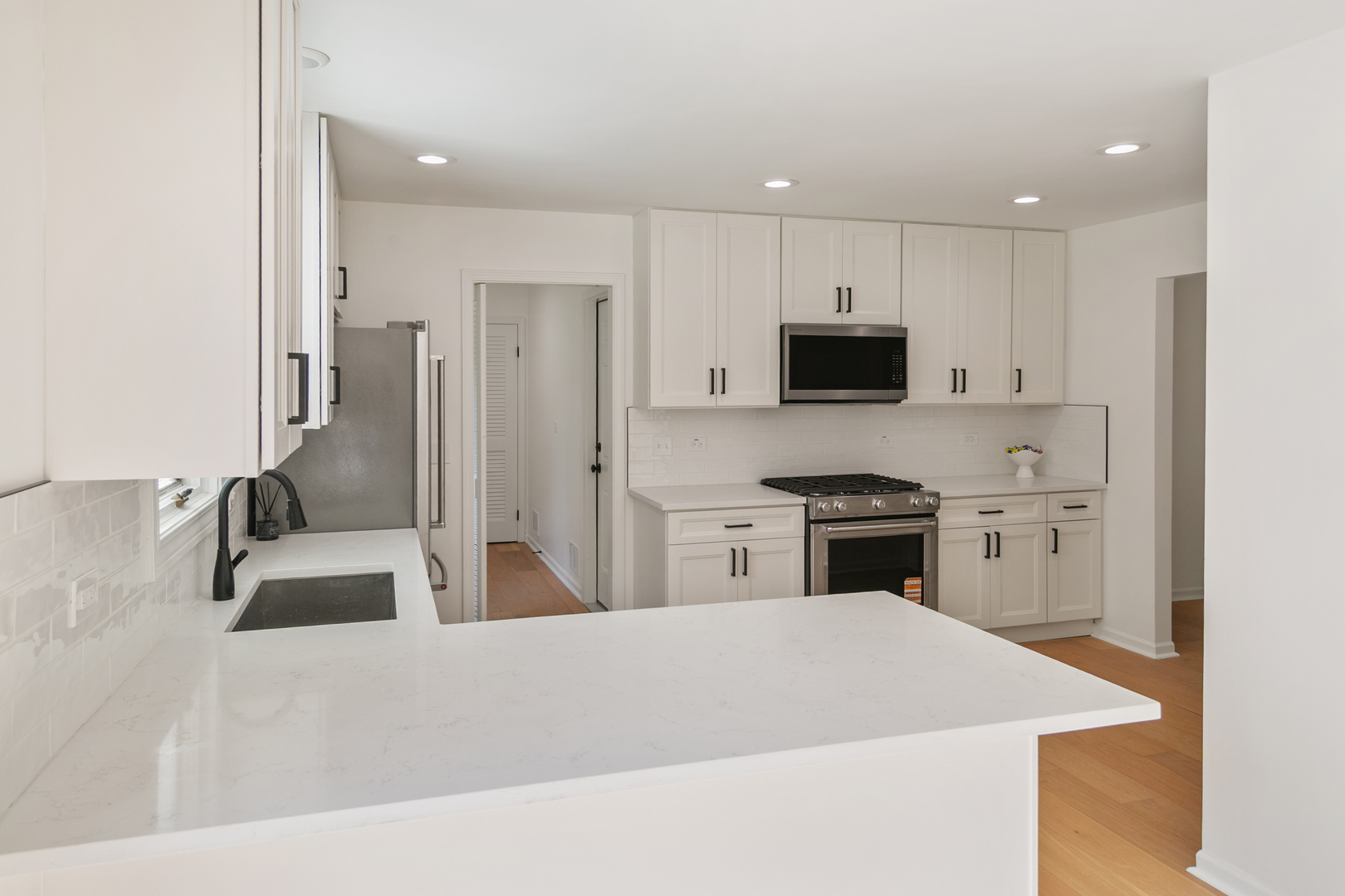 185 Cold Spring Road Barrington, IL 60010 - Photo 11 of 40 a kitchen with stainless steel appliances granite countertop a sink and a stove