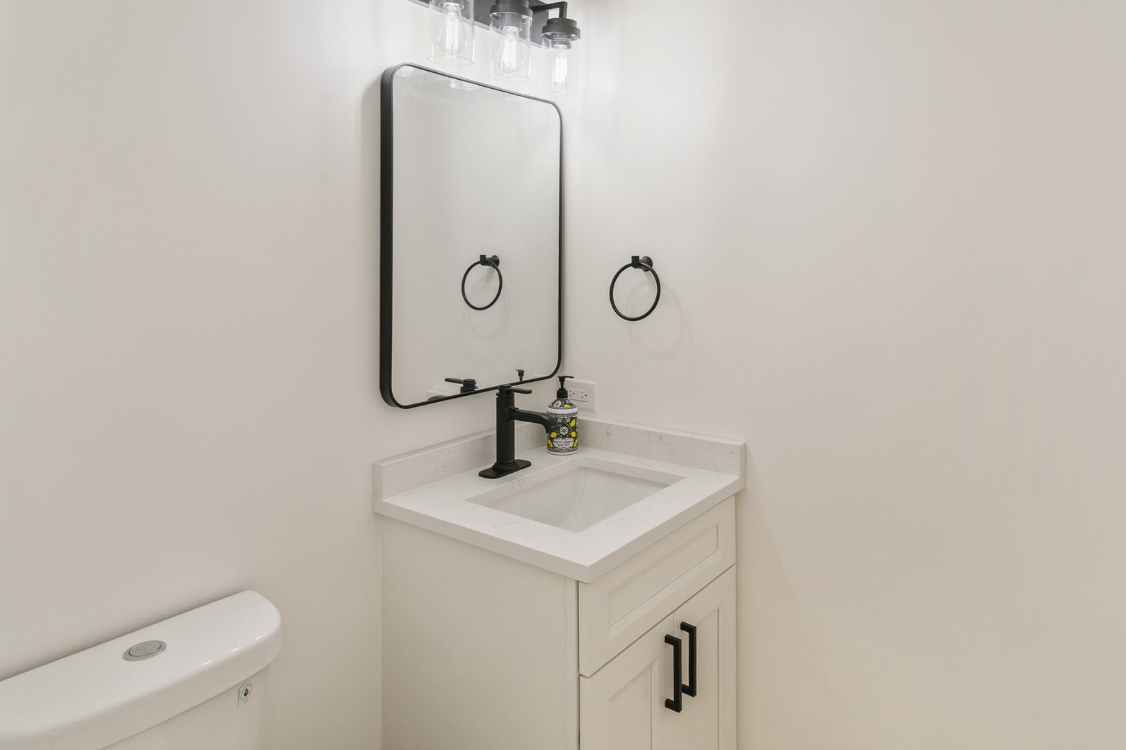 185 Cold Spring Road Barrington, IL 60010 - Photo 13 of 40 a bathroom with a toilet sink and mirror
