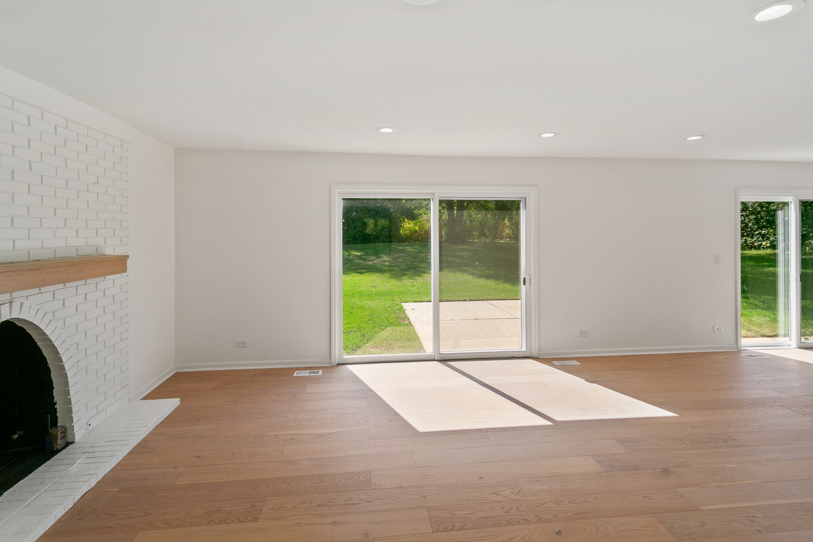 185 Cold Spring Road Barrington, IL 60010 - Photo 6 of 40 a view of an empty room with glass door and garden