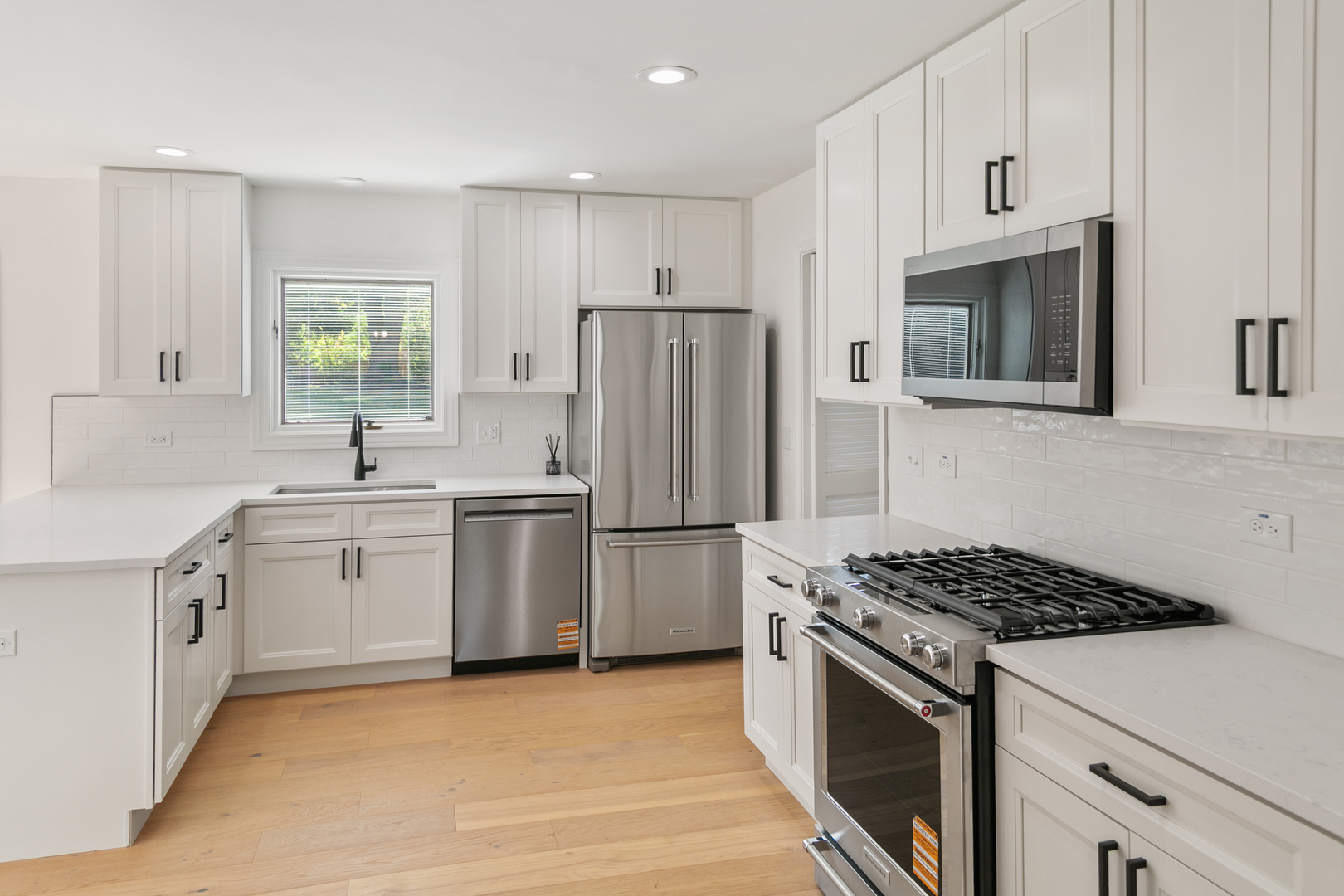 185 Cold Spring Road Barrington, IL 60010 - Photo 9 of 40 a kitchen with stove a sink and refrigerator