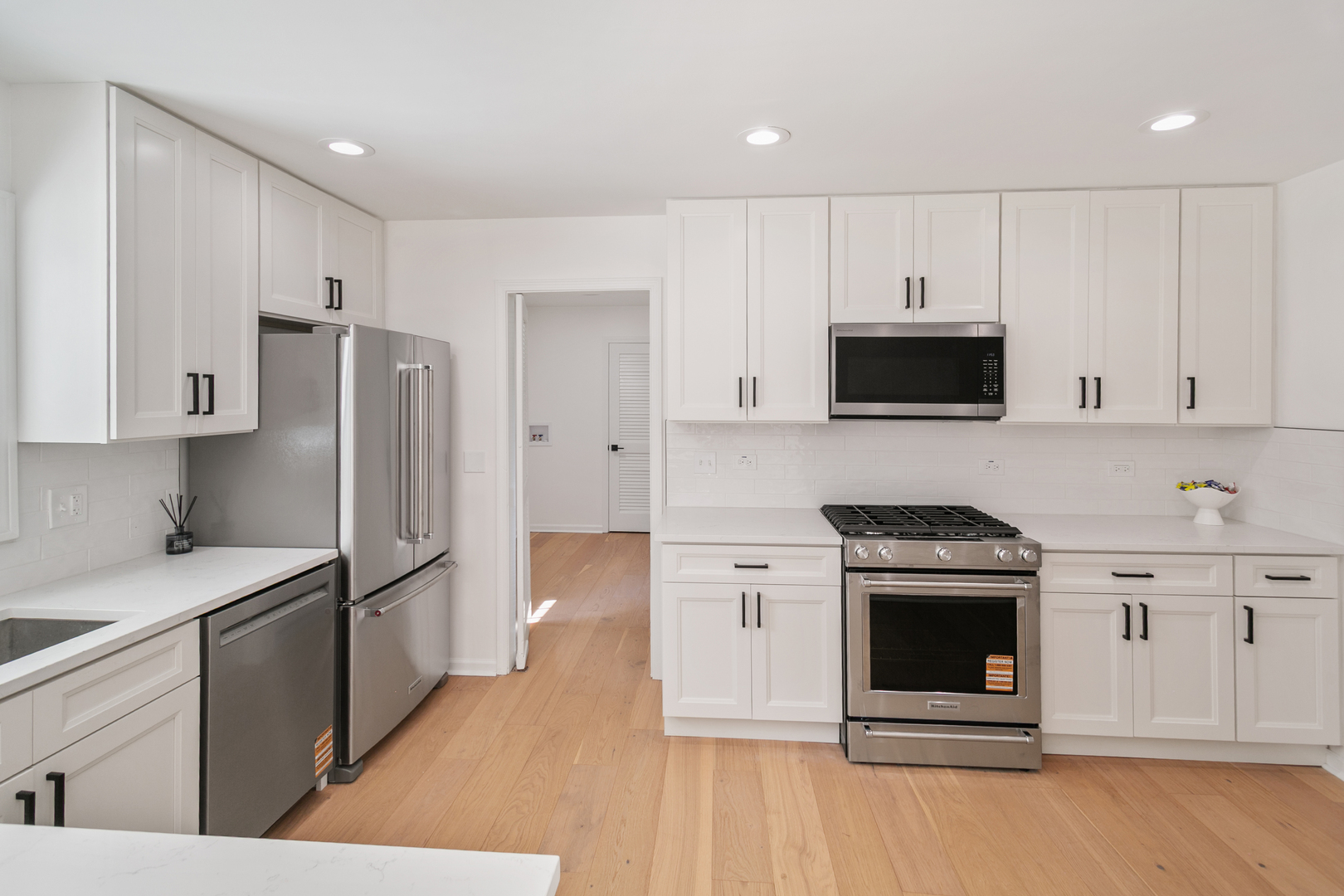 185 Cold Spring Road Barrington, IL 60010 - Photo 10 of 40 a kitchen with stainless steel appliances granite countertop a stove a refrigerator and a sink
