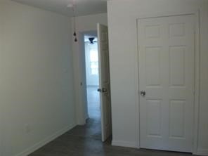 1714 North Travis Avenue Cleveland, TX 77327 - Photo 2 of 8 a view of an empty room