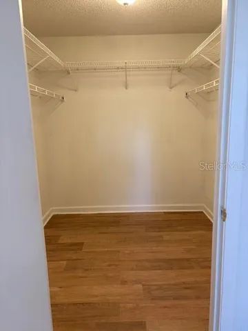 a view of an empty walk in closet