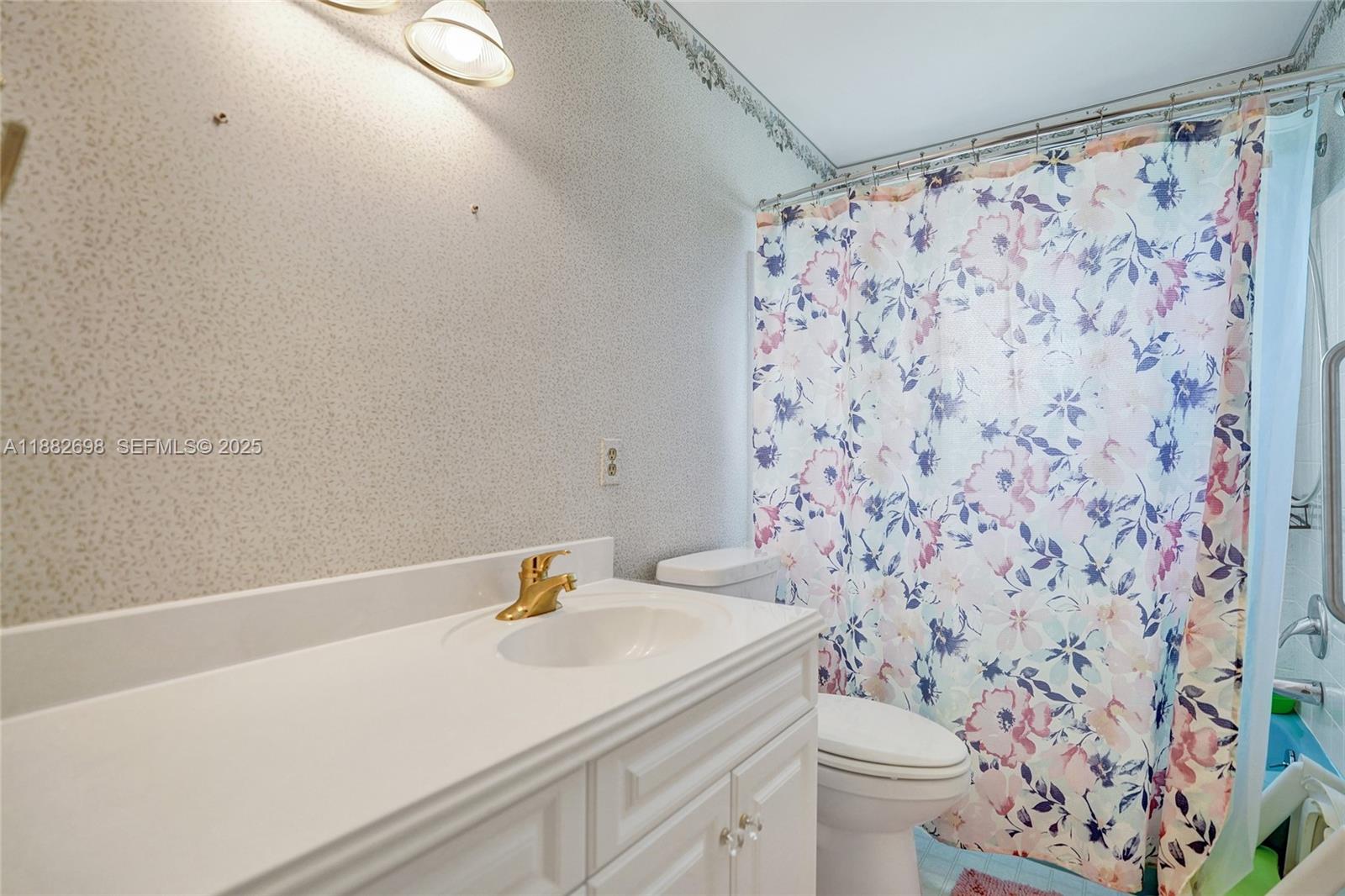 1021 Grandview Boulevard Fort Pierce, FL 34982 - Photo 12 of 34 a bathroom with a sink and a toilet