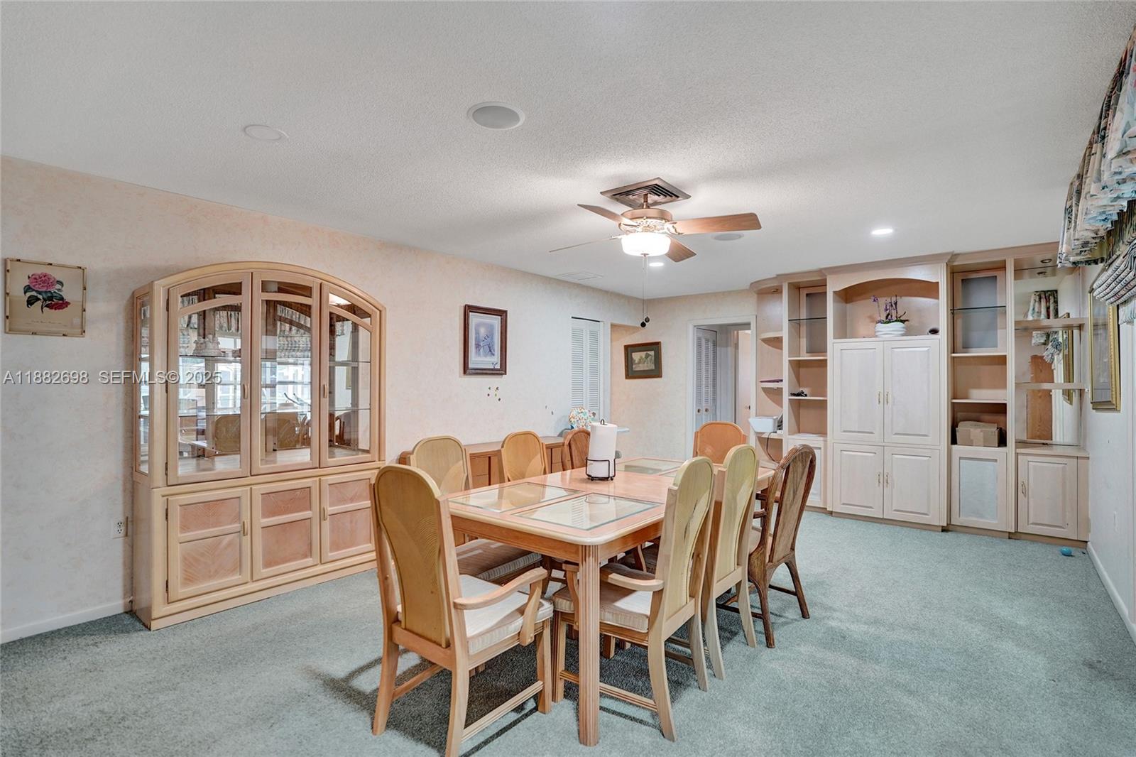 1021 Grandview Boulevard Fort Pierce, FL 34982 - Photo 13 of 34 a view of a dining room with furniture and chandelier