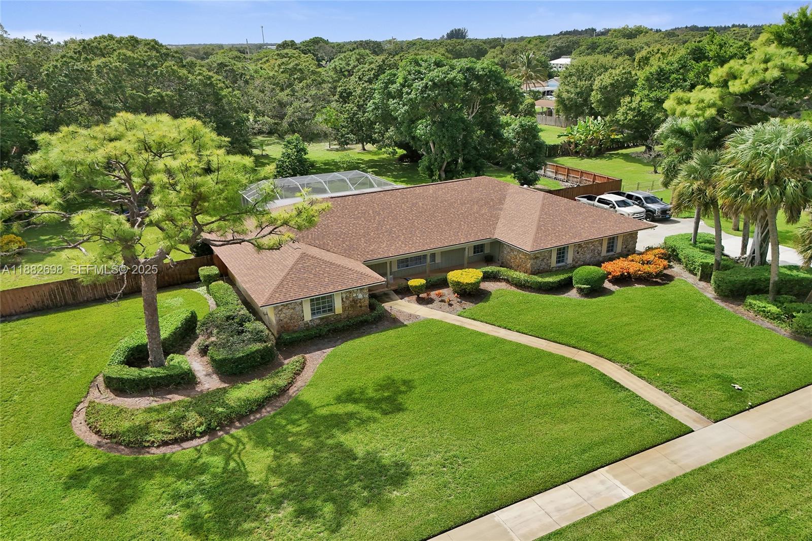 1021 Grandview Boulevard Fort Pierce, FL 34982 - Photo 2 of 34 an aerial view of residential houses with outdoor space and trees
