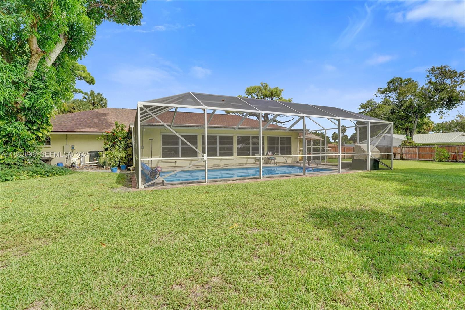 1021 Grandview Boulevard Fort Pierce, FL 34982 - Photo 23 of 34 a view of a house with yard and sitting area