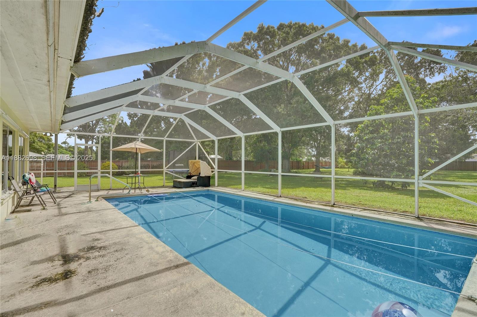 1021 Grandview Boulevard Fort Pierce, FL 34982 - Photo 24 of 34 a view of a backyard with a swimming pool