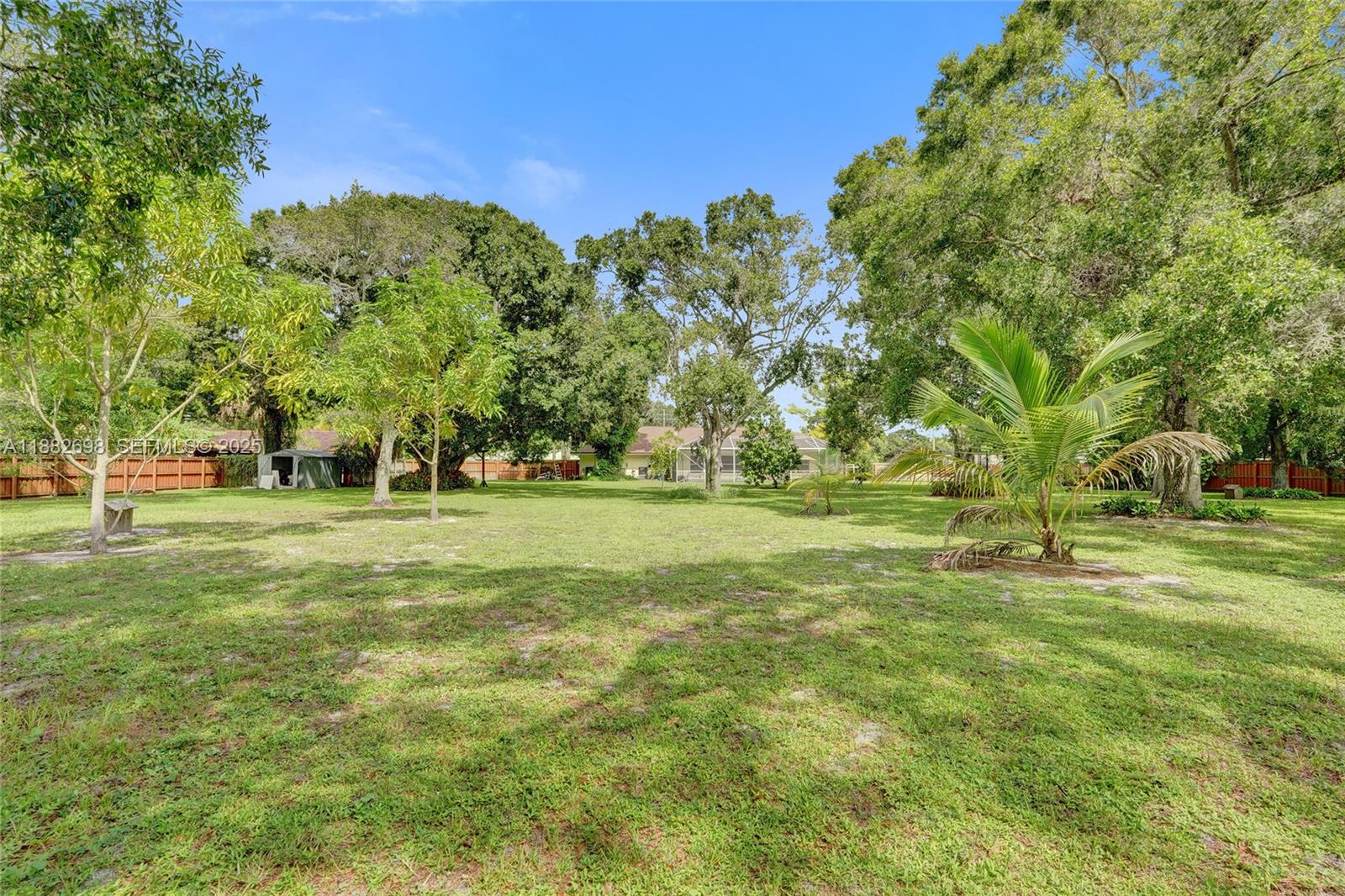 1021 Grandview Boulevard Fort Pierce, FL 34982 - Photo 27 of 34 a garden view with trees