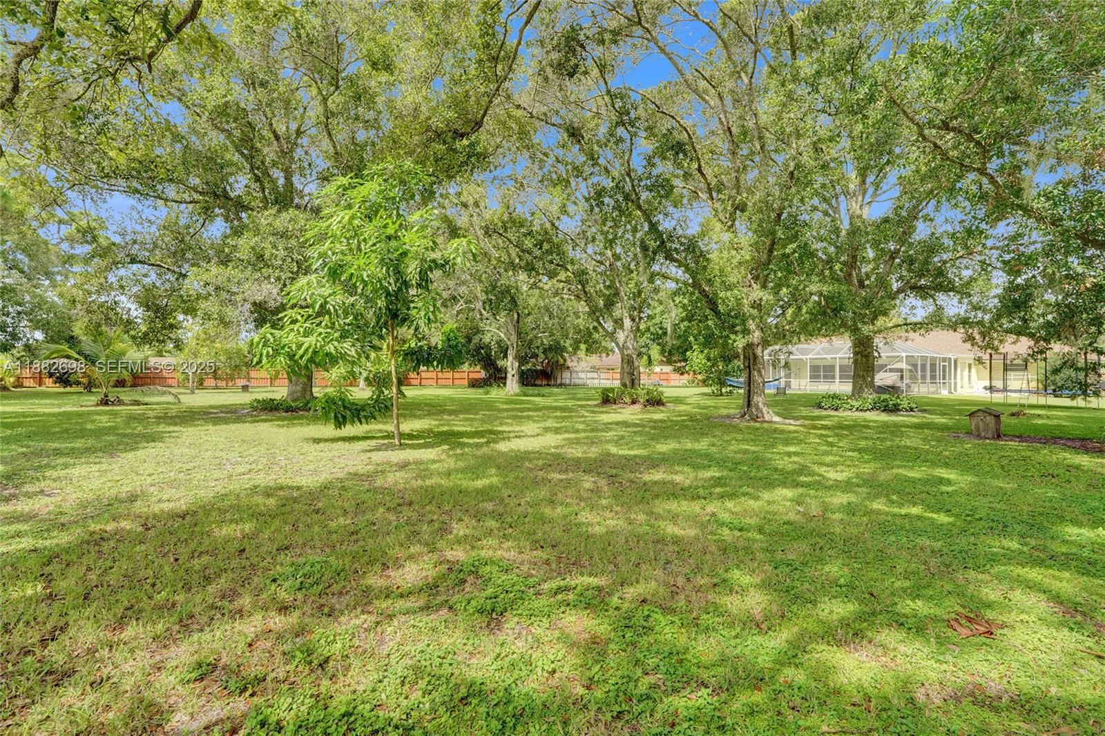 1021 Grandview Boulevard Fort Pierce, FL 34982 - Photo 28 of 34 a huge green field with lots of trees