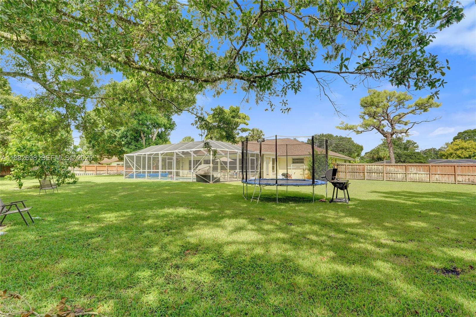 1021 Grandview Boulevard Fort Pierce, FL 34982 - Photo 29 of 34 a view of a park with a house in the background