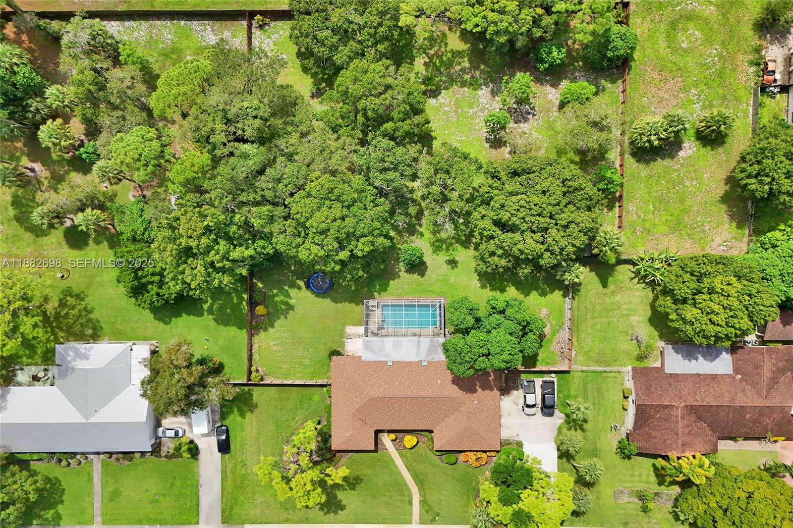 1021 Grandview Boulevard Fort Pierce, FL 34982 - Photo 31 of 34 an aerial view of a house with a yard basket ball court and outdoor seating