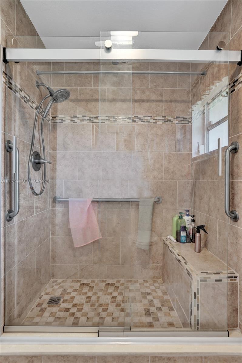 1021 Grandview Boulevard Fort Pierce, FL 34982 - Photo 9 of 34 a bathroom with a shower