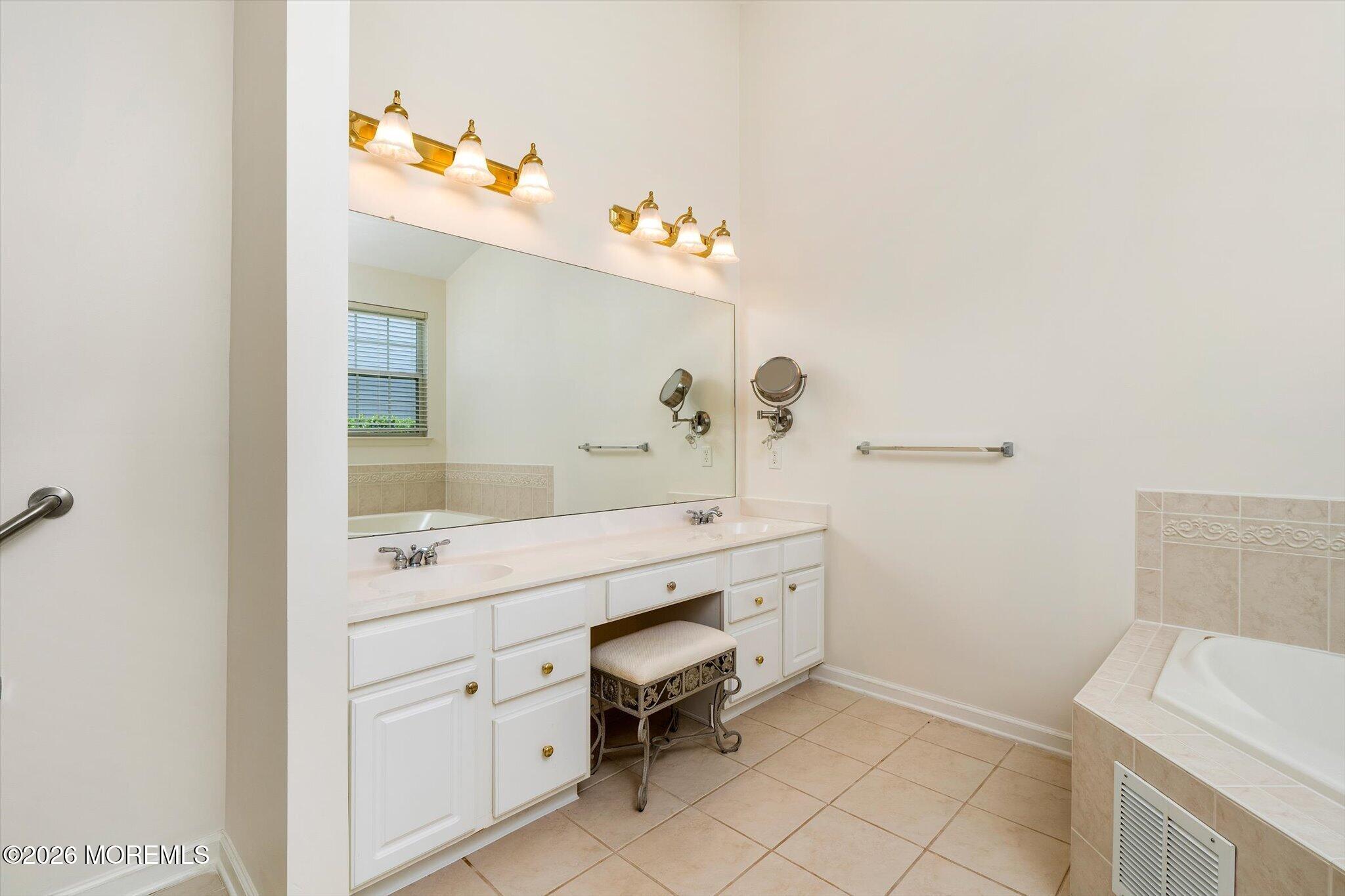 10 Powderhorn Way Allentown, NJ 08501 - Photo 17 of 27 a bathroom with a sink double vanity and a mirror