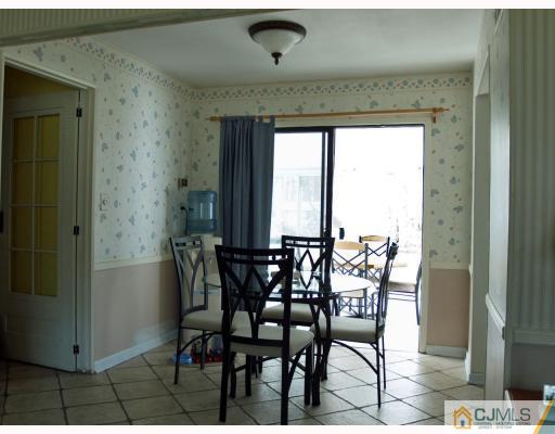 24 Harding Avenue Edison, NJ 08820 - Photo 5 of 10 a view of a dining room with furniture and window