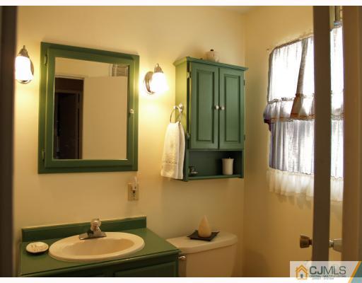 24 Harding Avenue Edison, NJ 08820 - Photo 8 of 10 a bathroom with a sink and a mirror