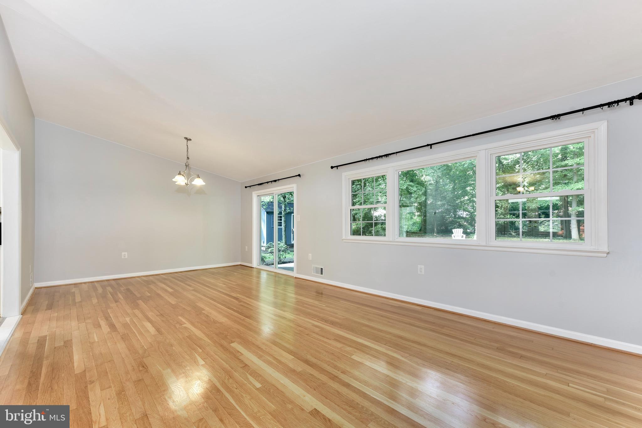5012 Dodson Drive Annandale, VA 22003 - Photo 13 of 44 an empty room with wooden floor and windows