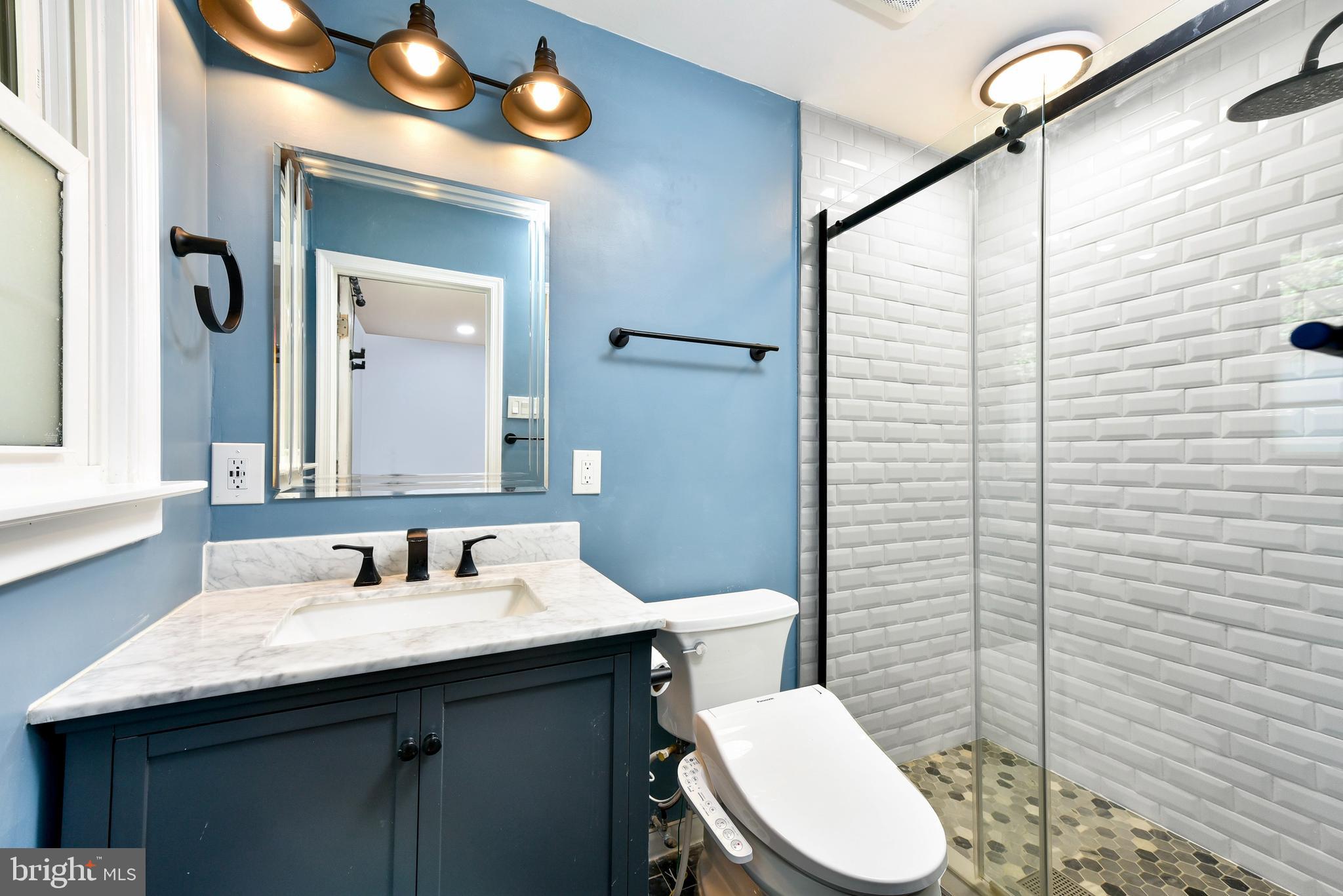 5012 Dodson Drive Annandale, VA 22003 - Photo 16 of 44 a bathroom with a toilet sink and mirror
