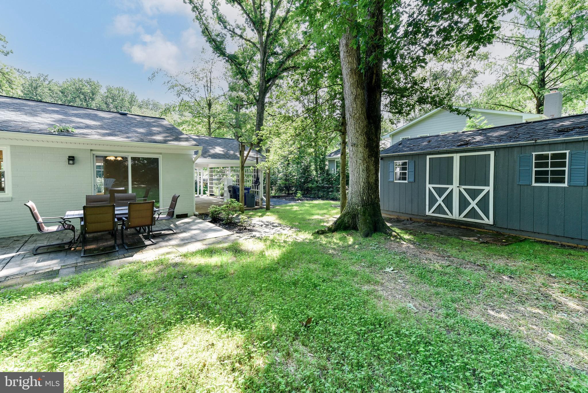 5012 Dodson Drive Annandale, VA 22003 - Photo 30 of 44 a view of backyard with a table and chairs and wooden fence