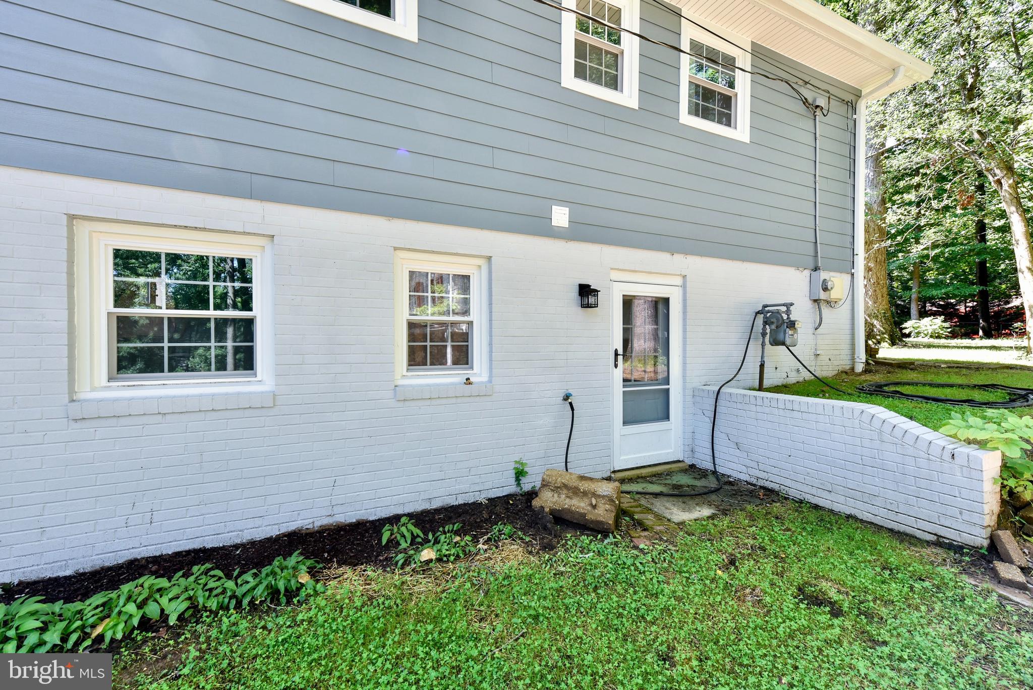 5012 Dodson Drive Annandale, VA 22003 - Photo 33 of 44 a front view of a house with a yard and outdoor seating