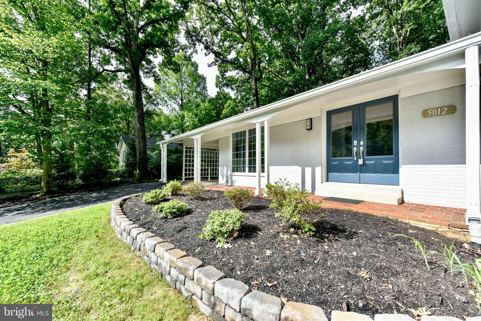 5012 Dodson Drive Annandale, VA 22003 - Photo 6 of 44 a front view of a house with garden