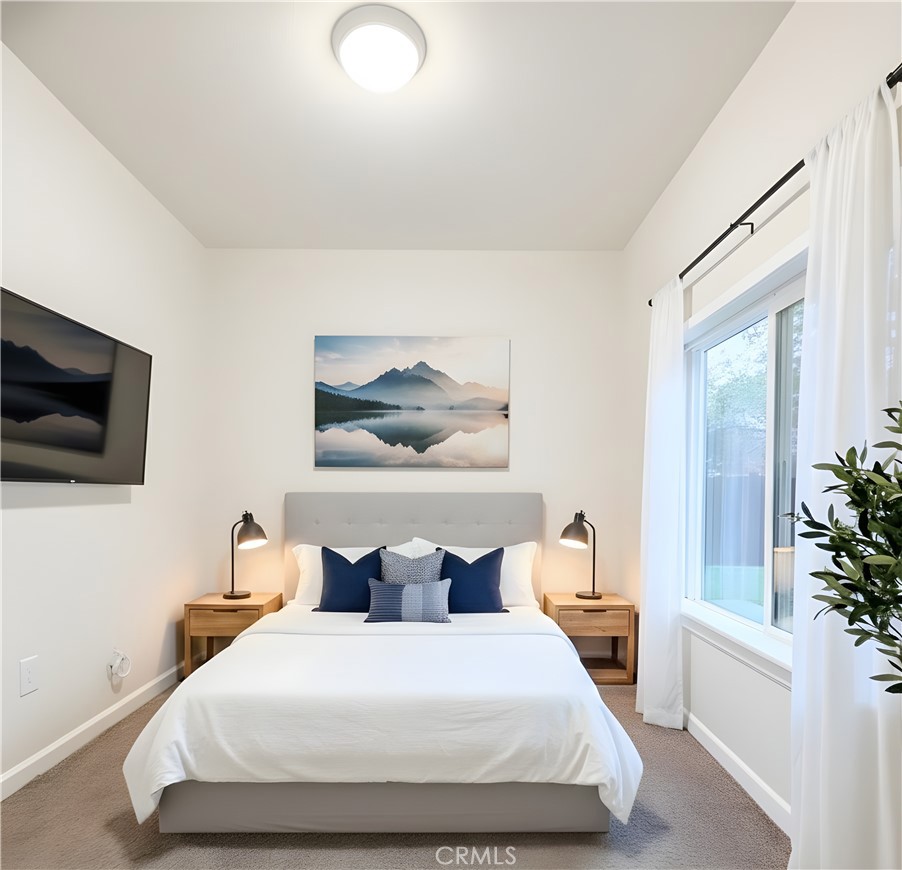 363 Ford Road Sacramento, CA 95838 - Photo 19 of 23 a bedroom with a large bed and a tv