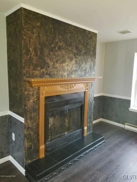 134 Ryan Road Blakeslee, PA 18610 - Photo 9 of 33 a fireplace with wooden floor