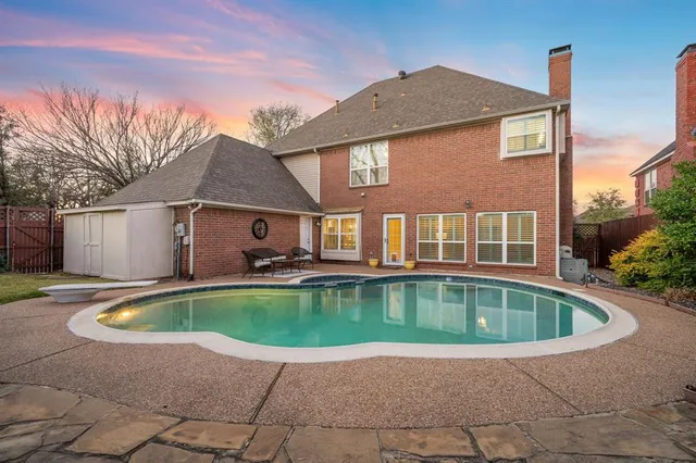 a view of swimming pool with seating space
