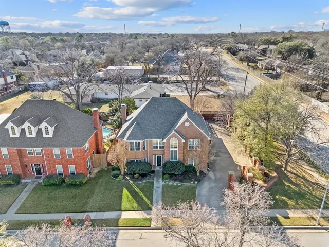 a view of a swimming pool with a yard