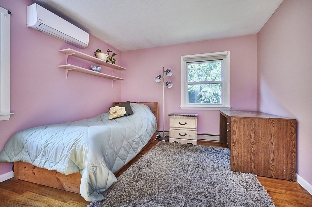 1021 Burts Pit Road Northampton, MA 01062 - Photo 17 of 33 a bedroom with a bed and wooden floor