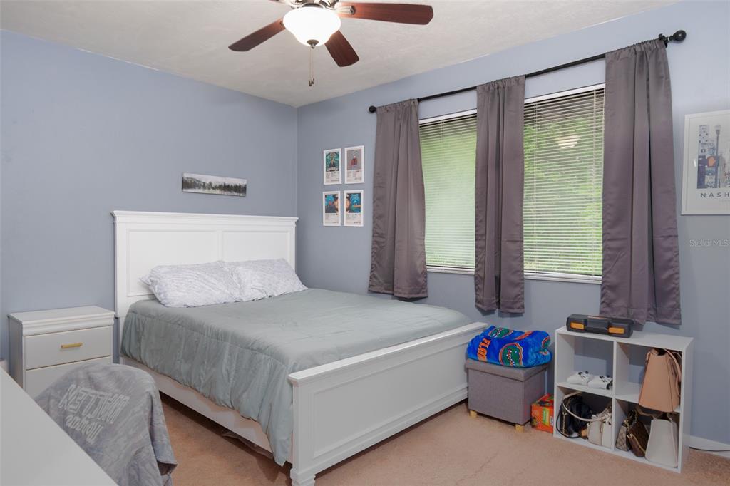 2300 Southwest 43rd Street, Unit K5 Gainesville, FL 32607 - Photo 10 of 18 a bedroom with a bed and a window