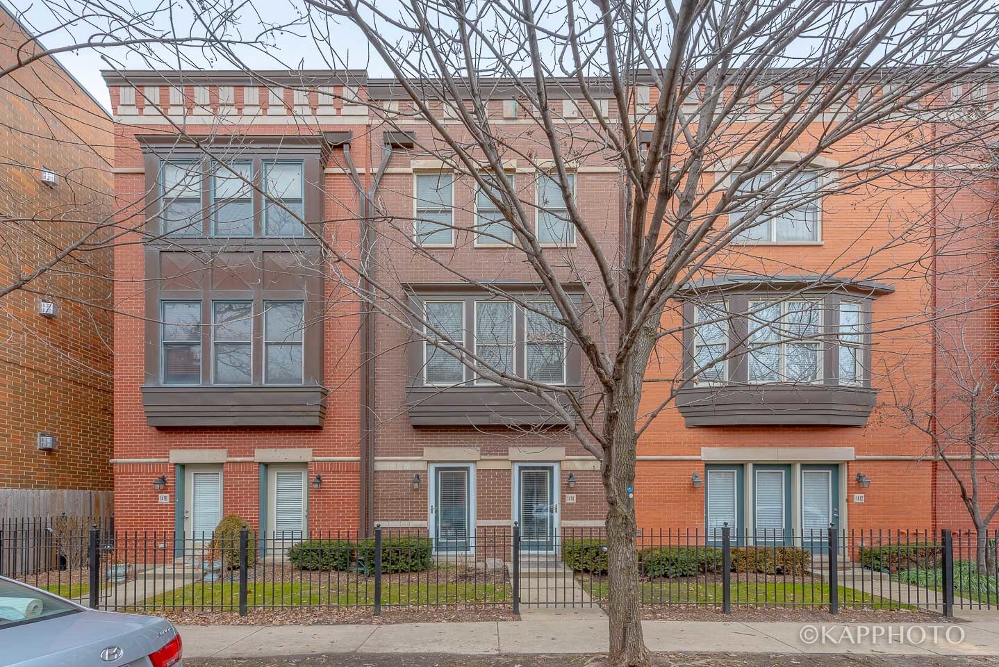 1414 West Fillmore Street Chicago, IL 60607 - Photo 1 of 1 front view of a brick house with a large windows