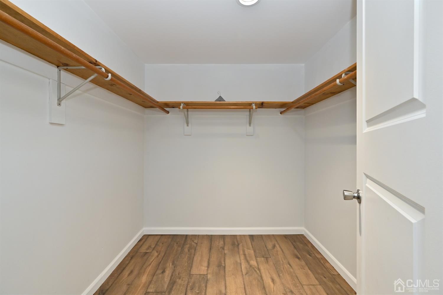 383 Paterson Avenue East Rutherford, NJ 07073 - Photo 12 of 21 a view of closet with wooden floor