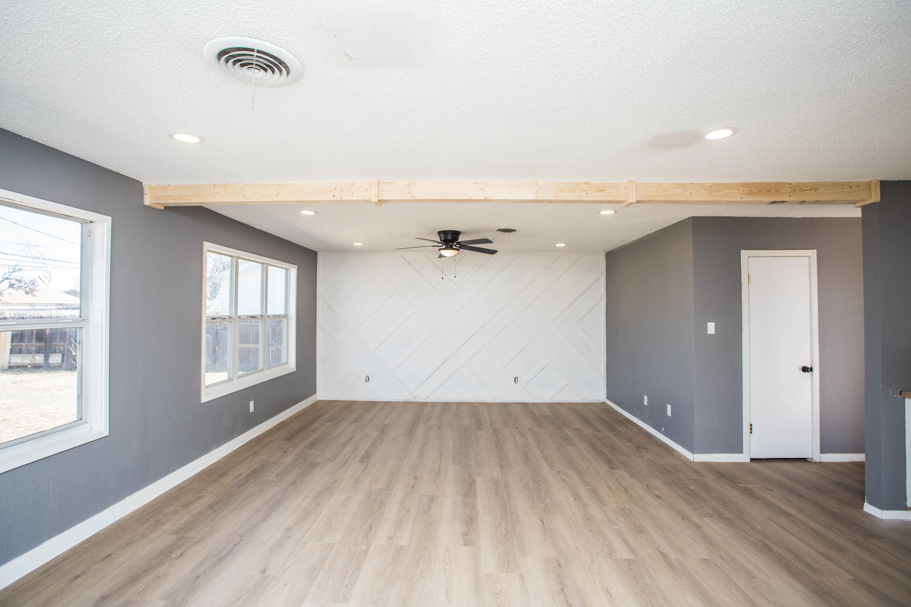 5212 41st Street Lubbock, TX 79414 - Photo 15 of 35 an empty room with wooden floor and windows