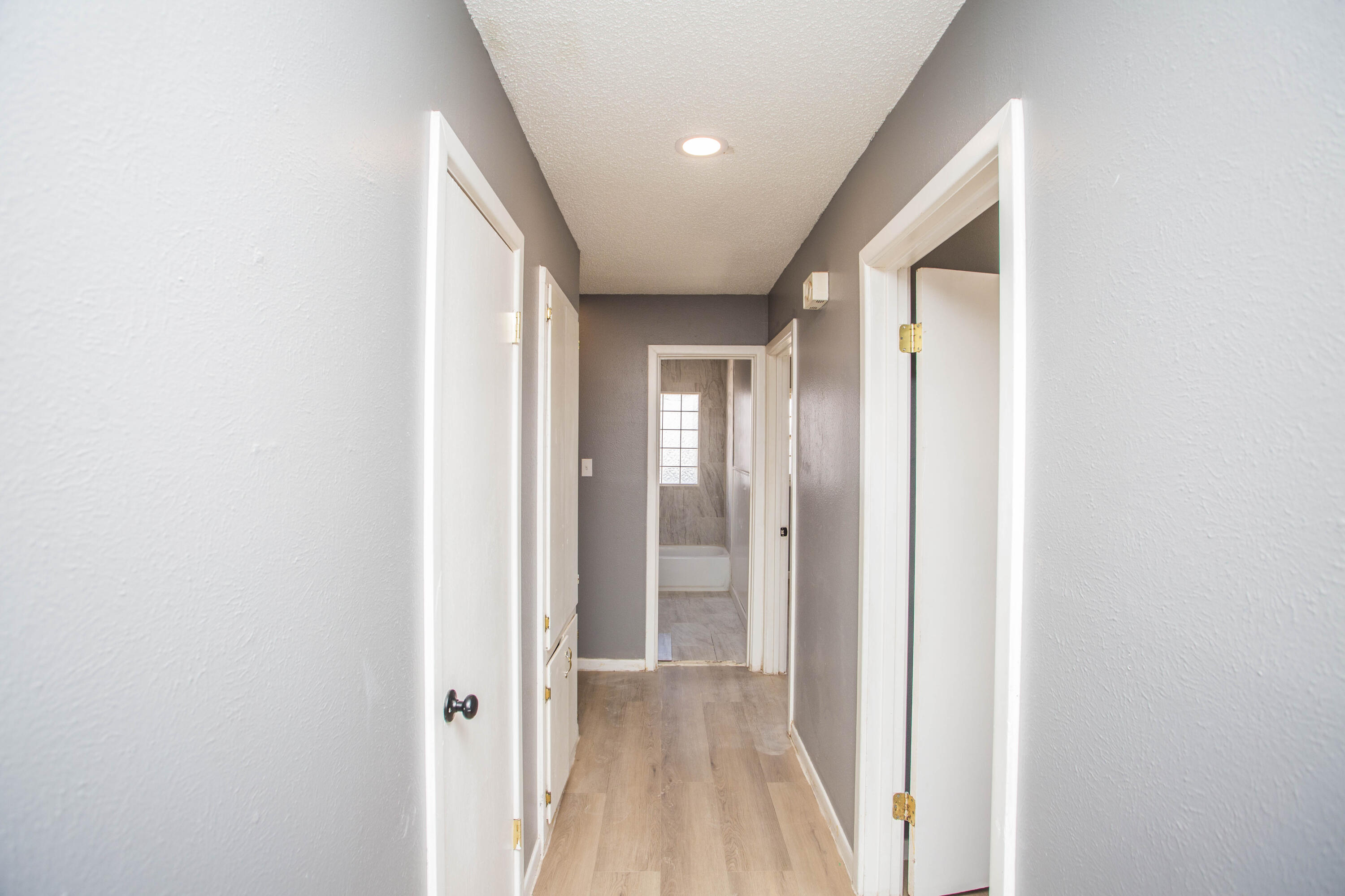 5212 41st Street Lubbock, TX 79414 - Photo 19 of 35 a view of a hallway with wooden floor