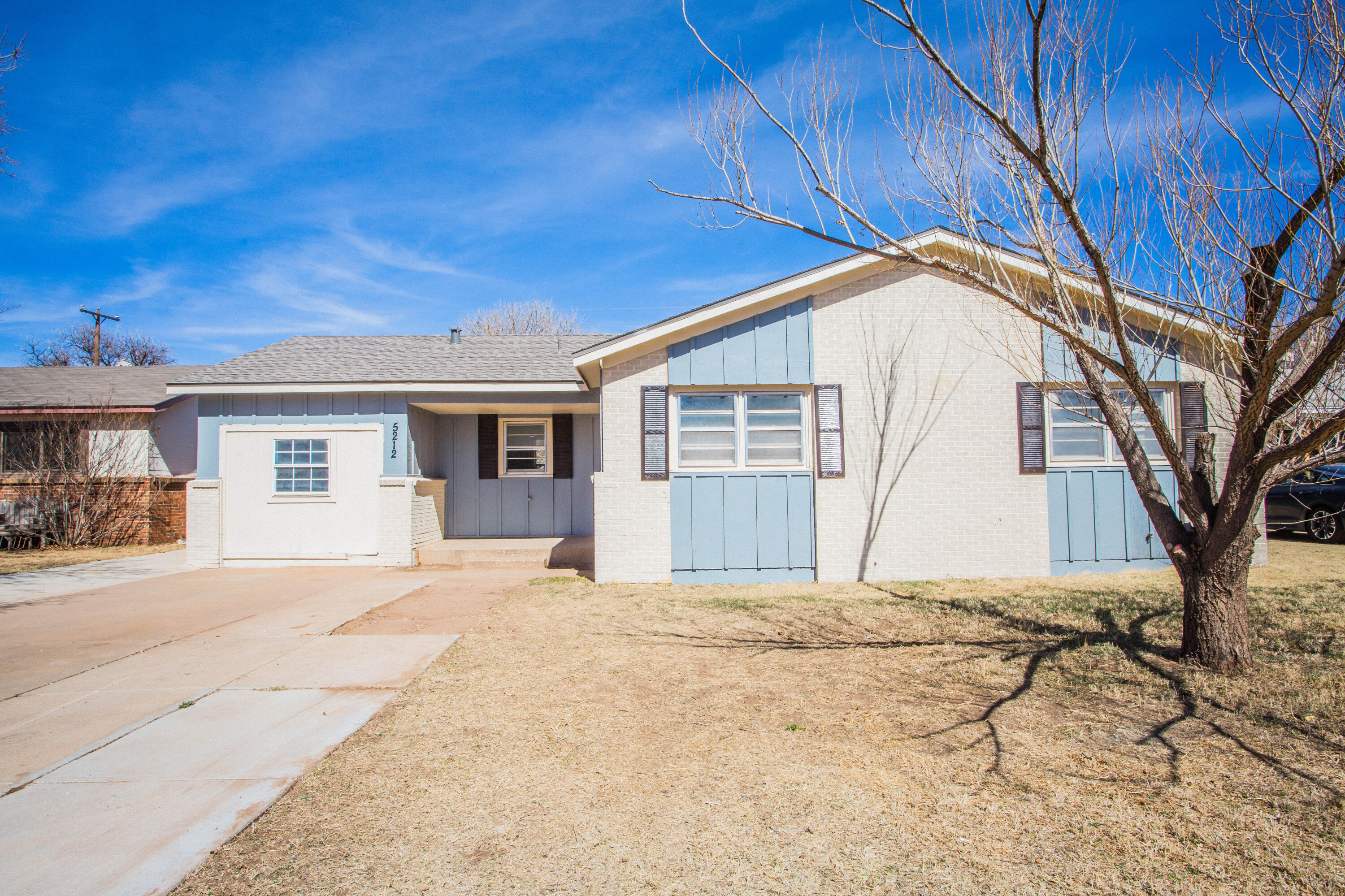 5212 41st Street Lubbock, TX 79414 - Photo 2 of 35 a view of a house with a snow in the yard