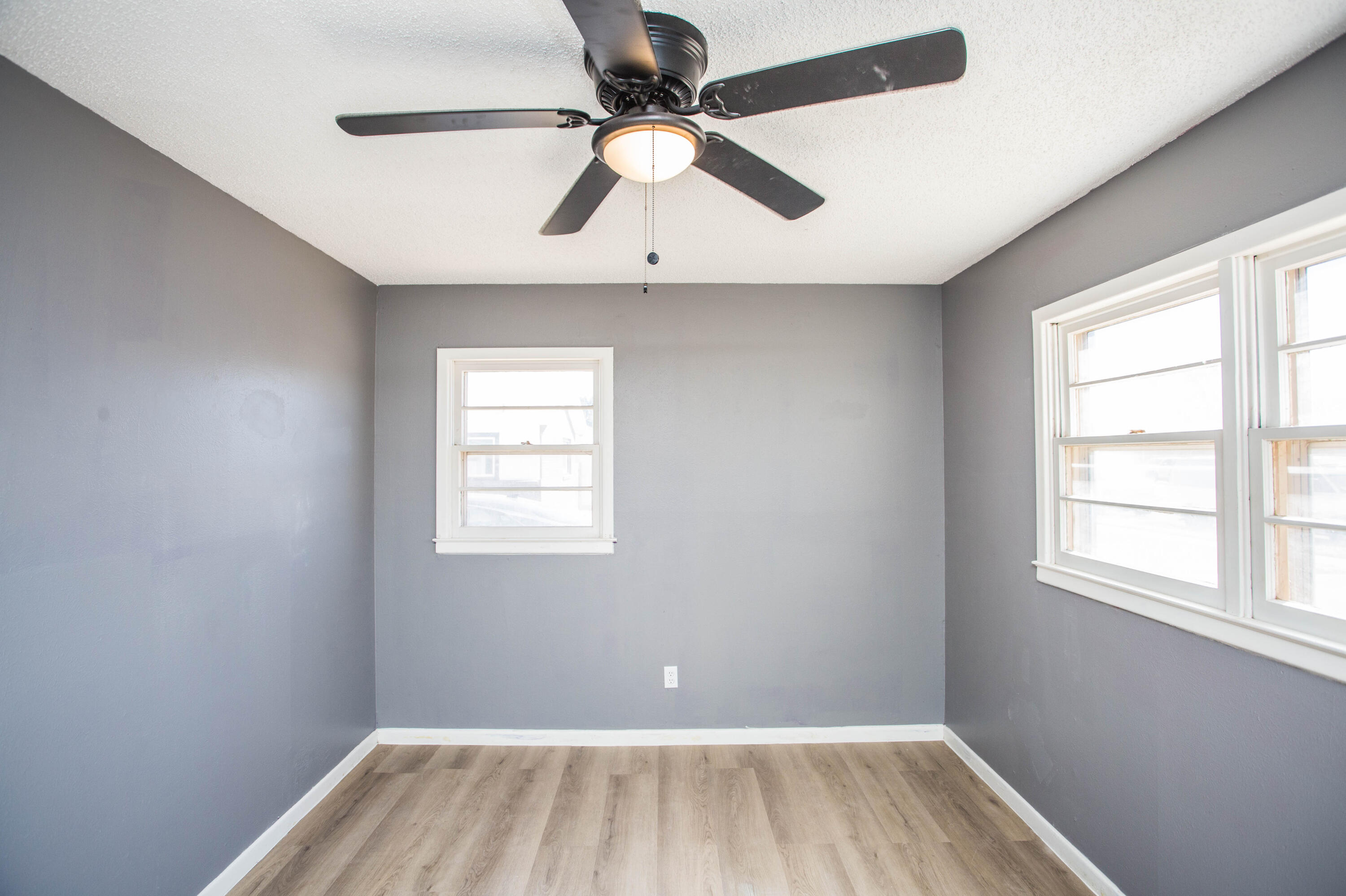 5212 41st Street Lubbock, TX 79414 - Photo 23 of 35 a view of room with a ceiling fan and window