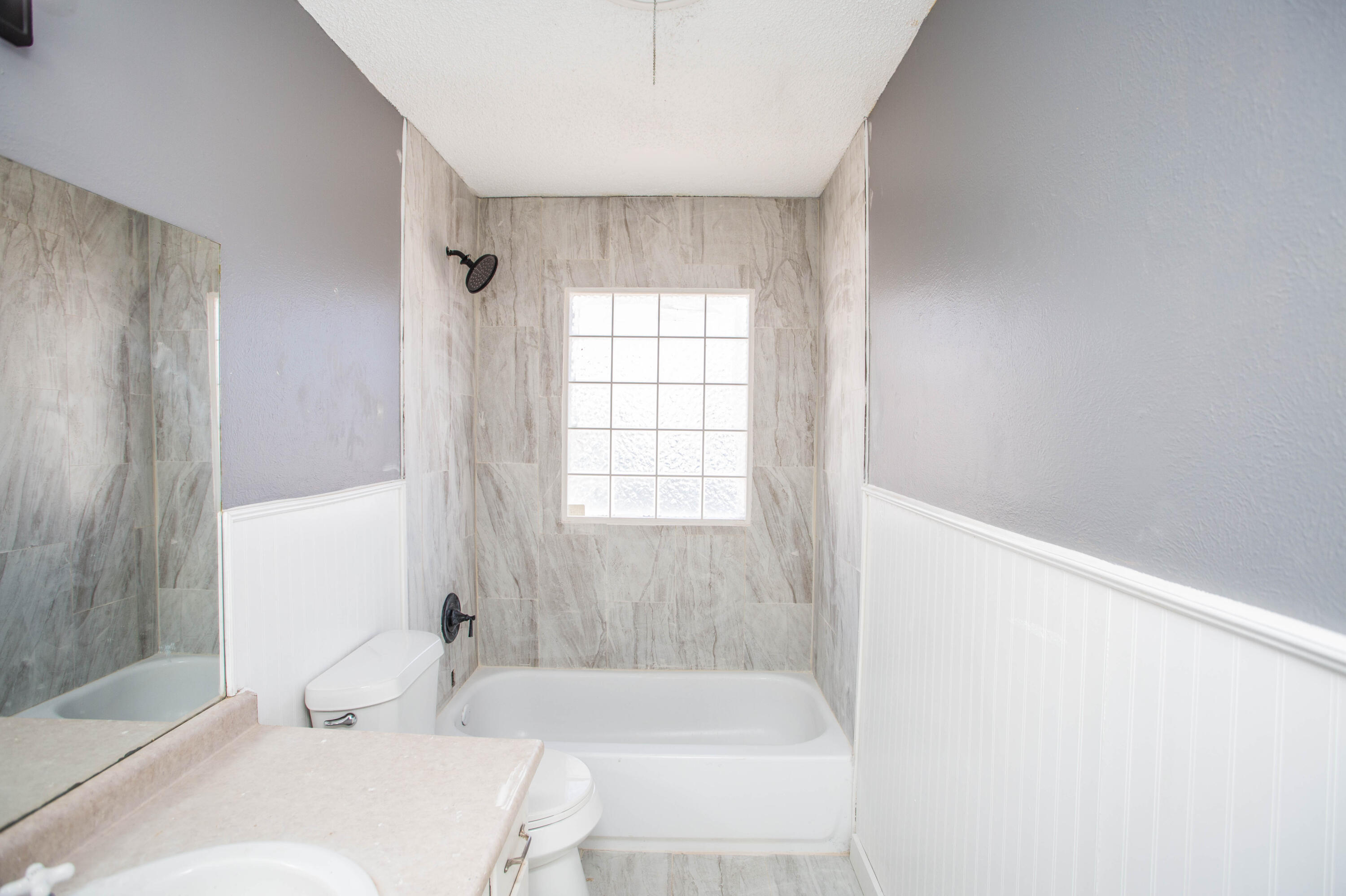 5212 41st Street Lubbock, TX 79414 - Photo 26 of 35 a bathroom with a bathtub and shower