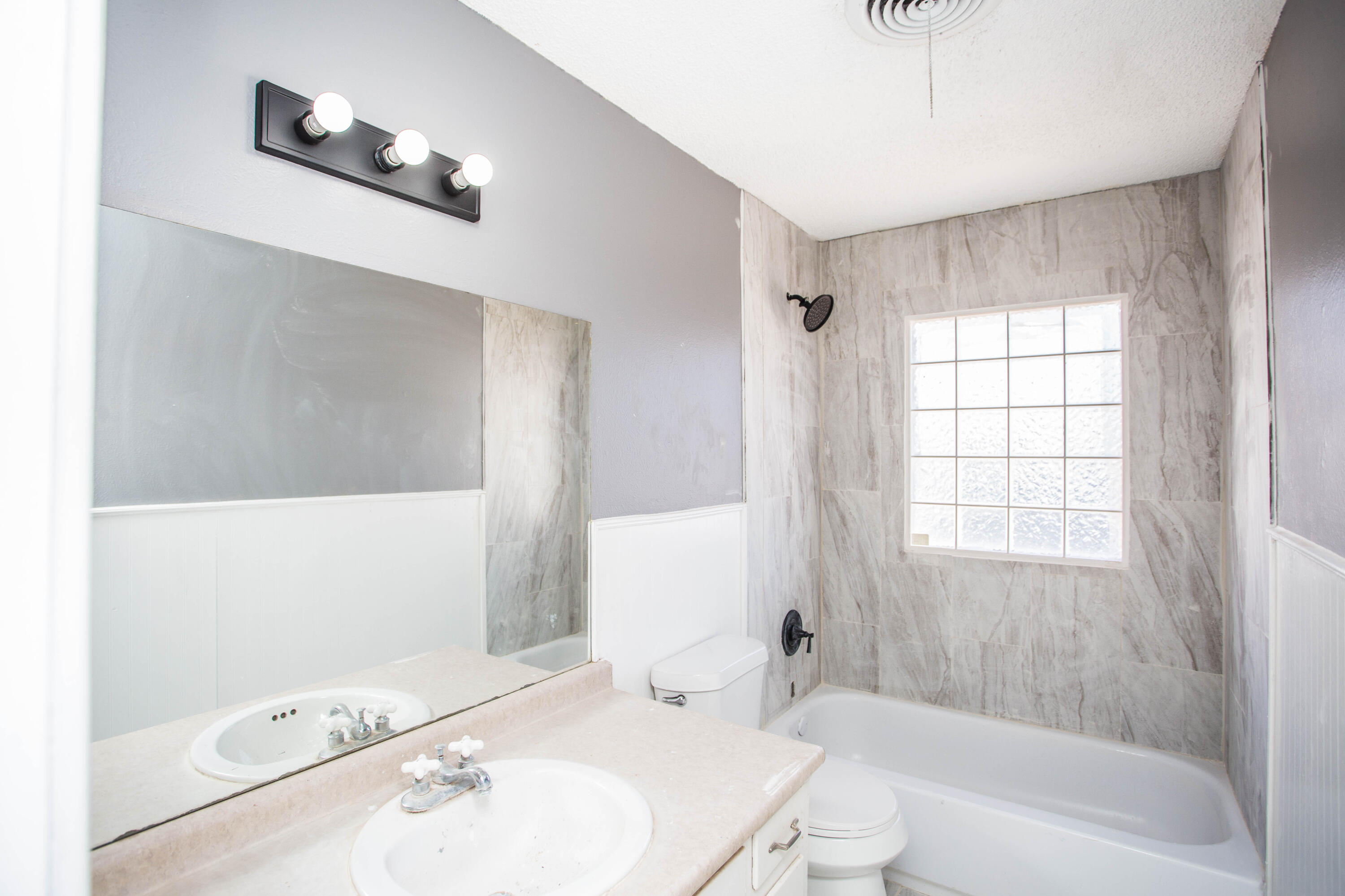 5212 41st Street Lubbock, TX 79414 - Photo 27 of 35 a bathroom with a bathtub and a sink