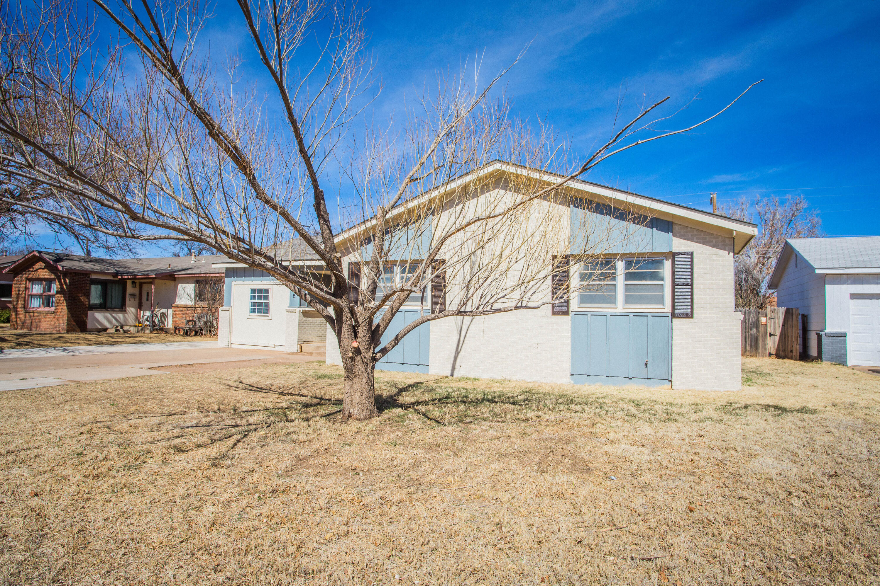 5212 41st Street Lubbock, TX 79414 - Photo 3 of 35 a view of a house with snow on the wall