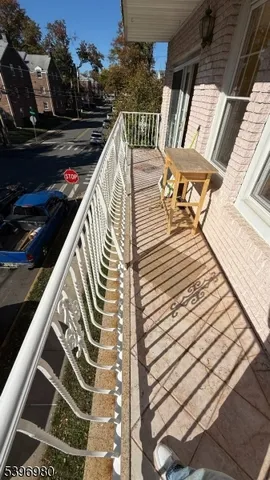 a balcony with view of outdoor space