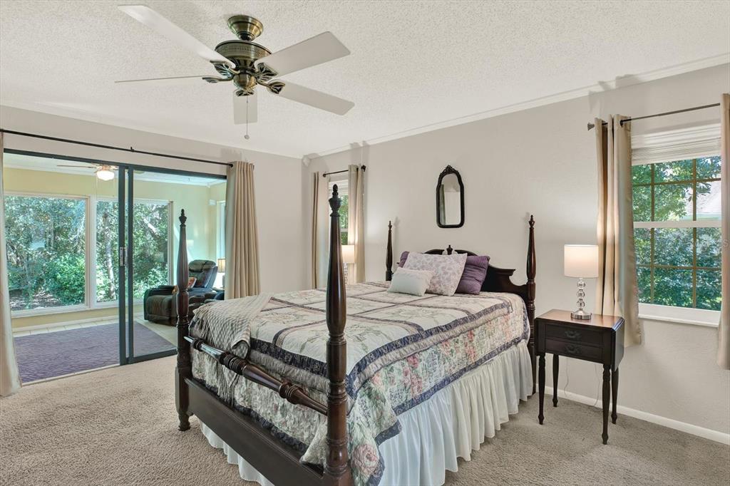 5 Balsam Court South Homosassa, FL 34446 - Photo 11 of 35 a bedroom with a bed and a large window with outer view