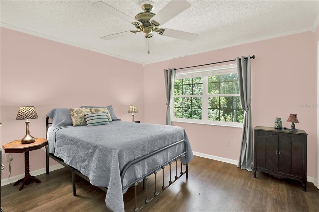 5 Balsam Court South Homosassa, FL 34446 - Photo 17 of 35 a bedroom with a bed and wooden floor