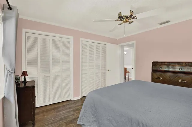 a bedroom with a bed and a closet