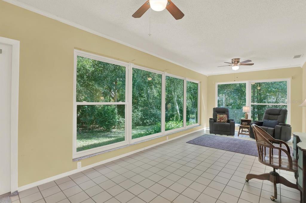 5 Balsam Court South Homosassa, FL 34446 - Photo 23 of 35 a living room with furniture and a large window