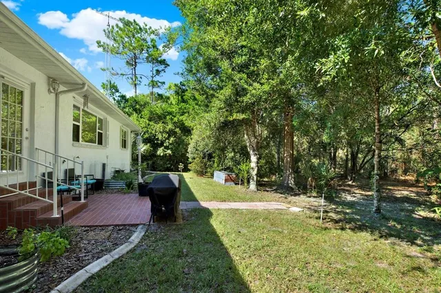 a view of yard with patio
