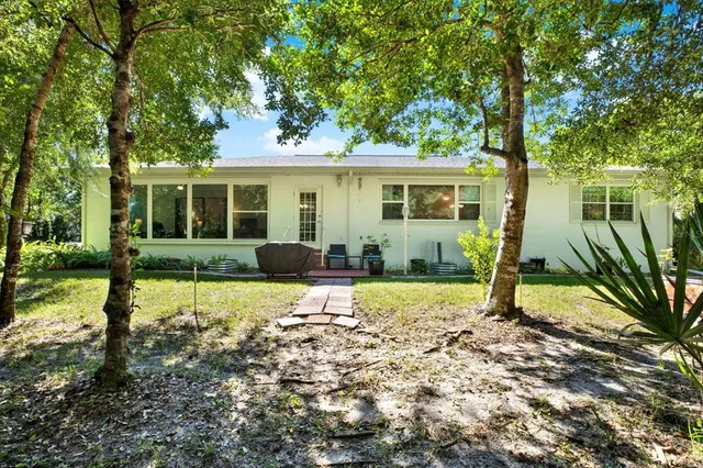 a house with trees in front of it