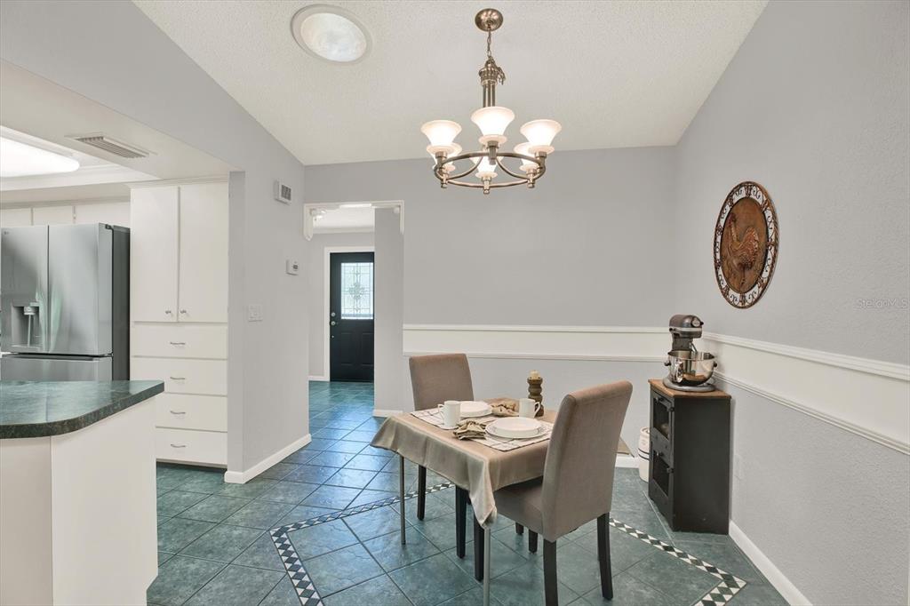 5 Balsam Court South Homosassa, FL 34446 - Photo 6 of 35 a view of a dining room with furniture and chandelier
