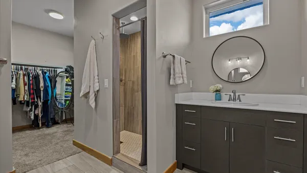 a bathroom with a sink and a mirror