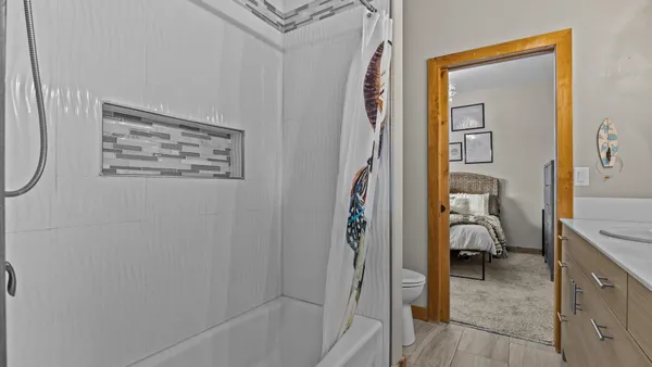 a en suite bathroom with a sink and a mirror